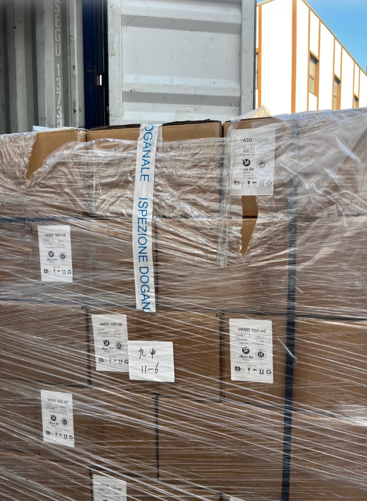Customs inspection tape on boxes