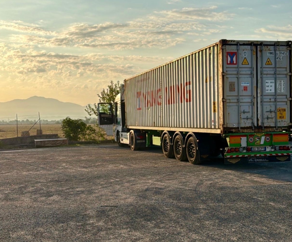 Yang Ming container trailer truck at sunset